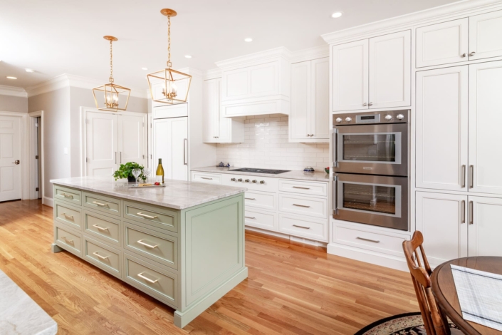 white kitchen with green island