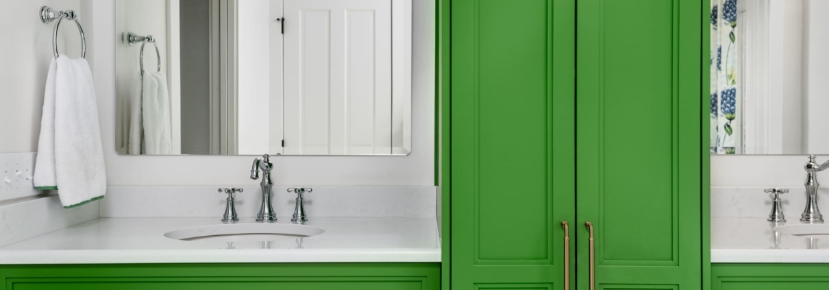 green bathroom with two sinks