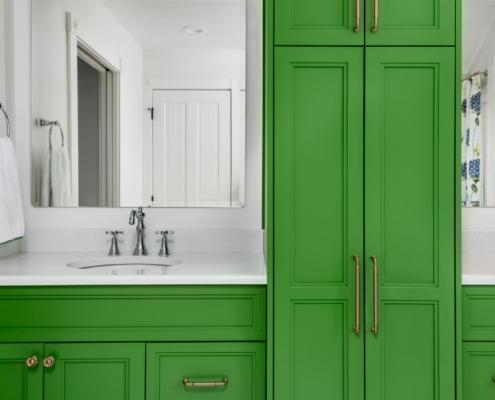 green bathroom with two sinks