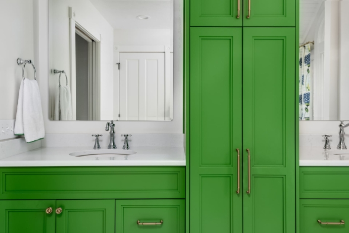 green bathroom with two sinks