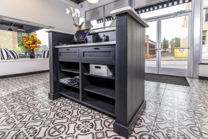 133 West hostess stand and tile flooring