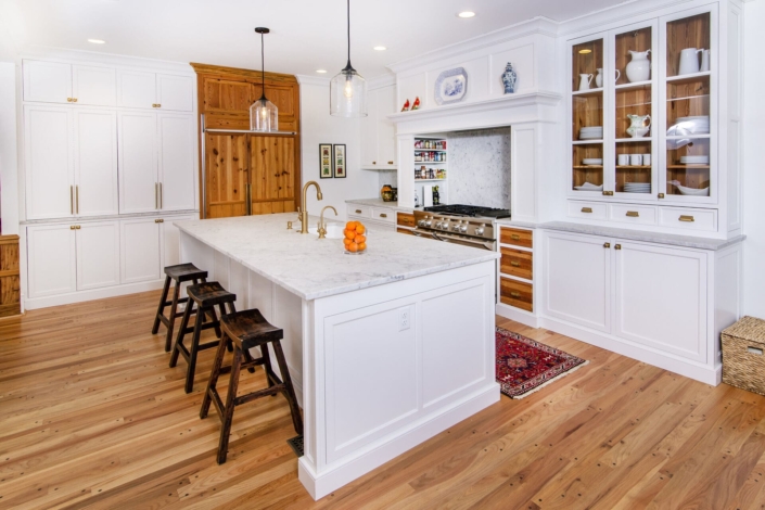 glass cabinets with walnut shelves