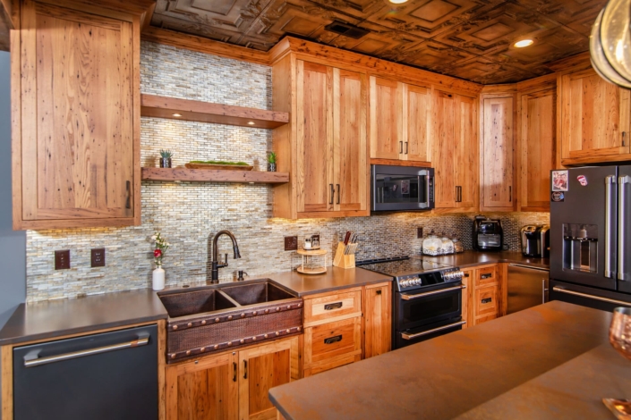 brown kitchen with tile backsplash