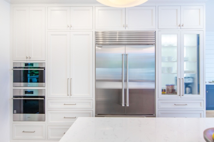 white kitchen with glass cabinet doors