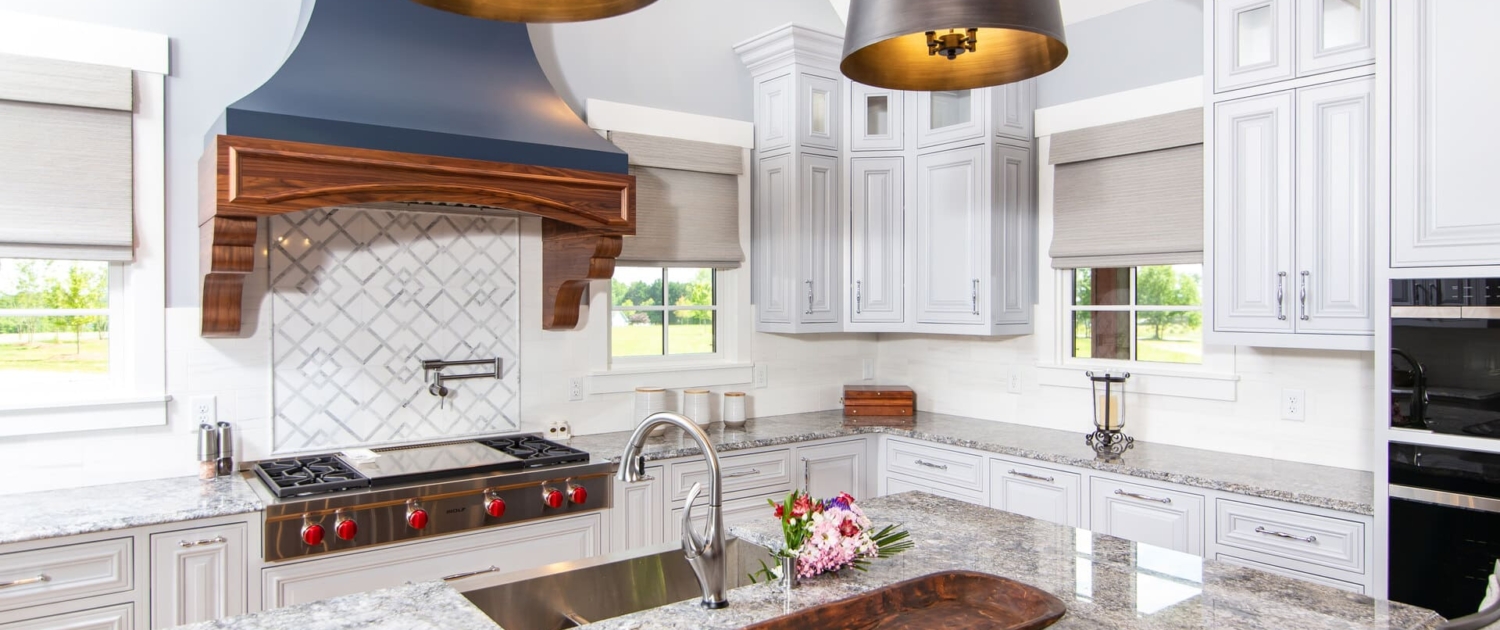 white kitchen with a blue hood