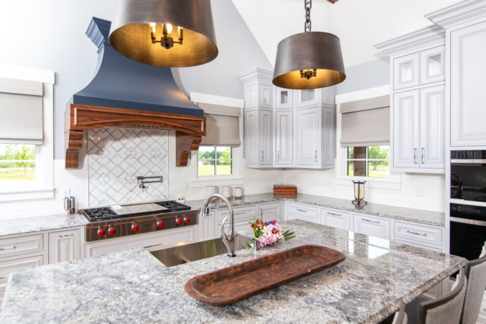 white kitchen with a blue hood
