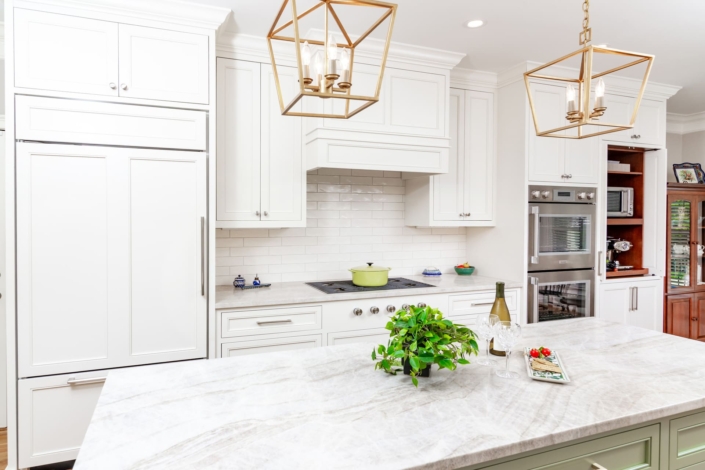 white kitchen with gold lights