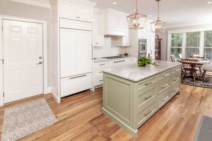 white kitchen with green island