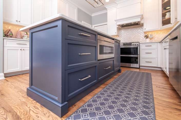 blue kitchen island with a runner