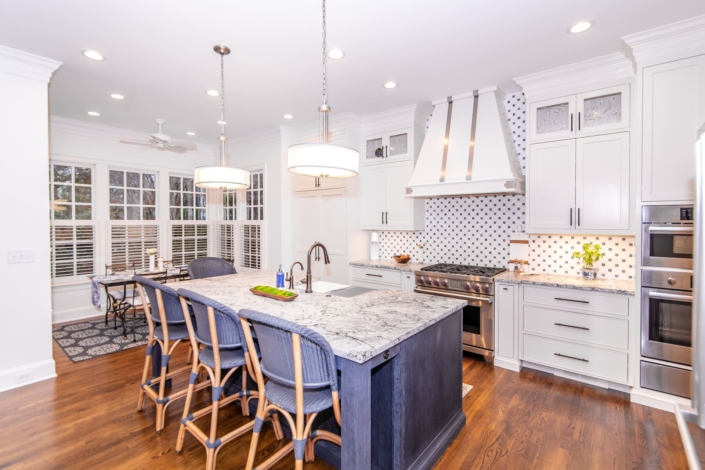 white kitchen with a blue island