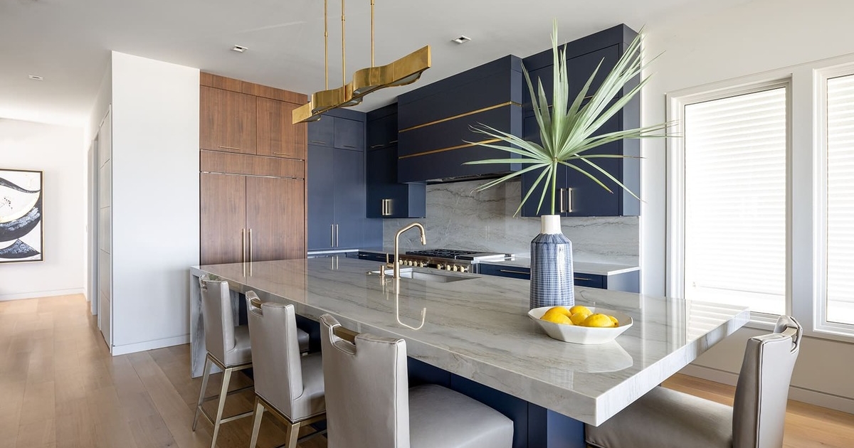 blue and walnut kitchen with a big island