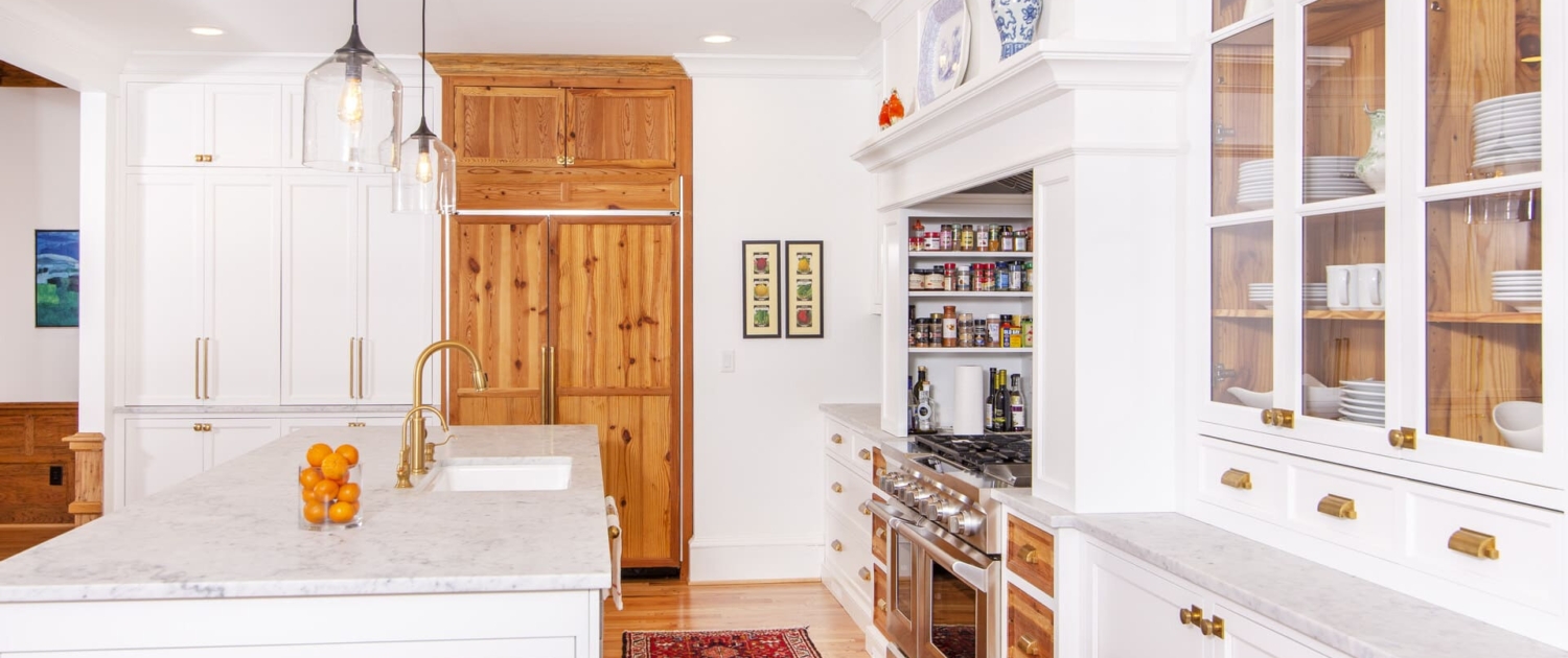 white kitchen with a red runner rug