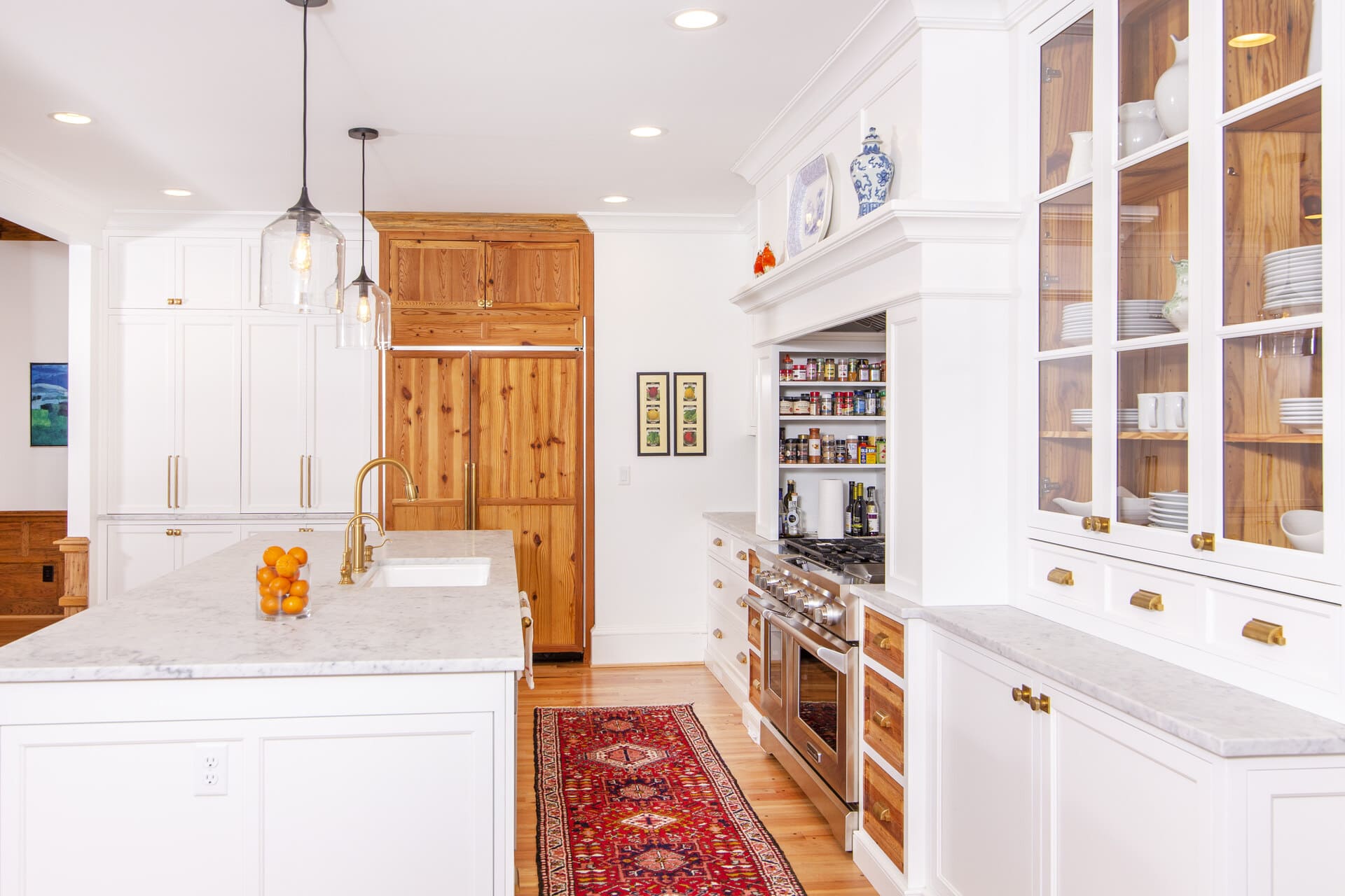 white kitchen with a red runner rug