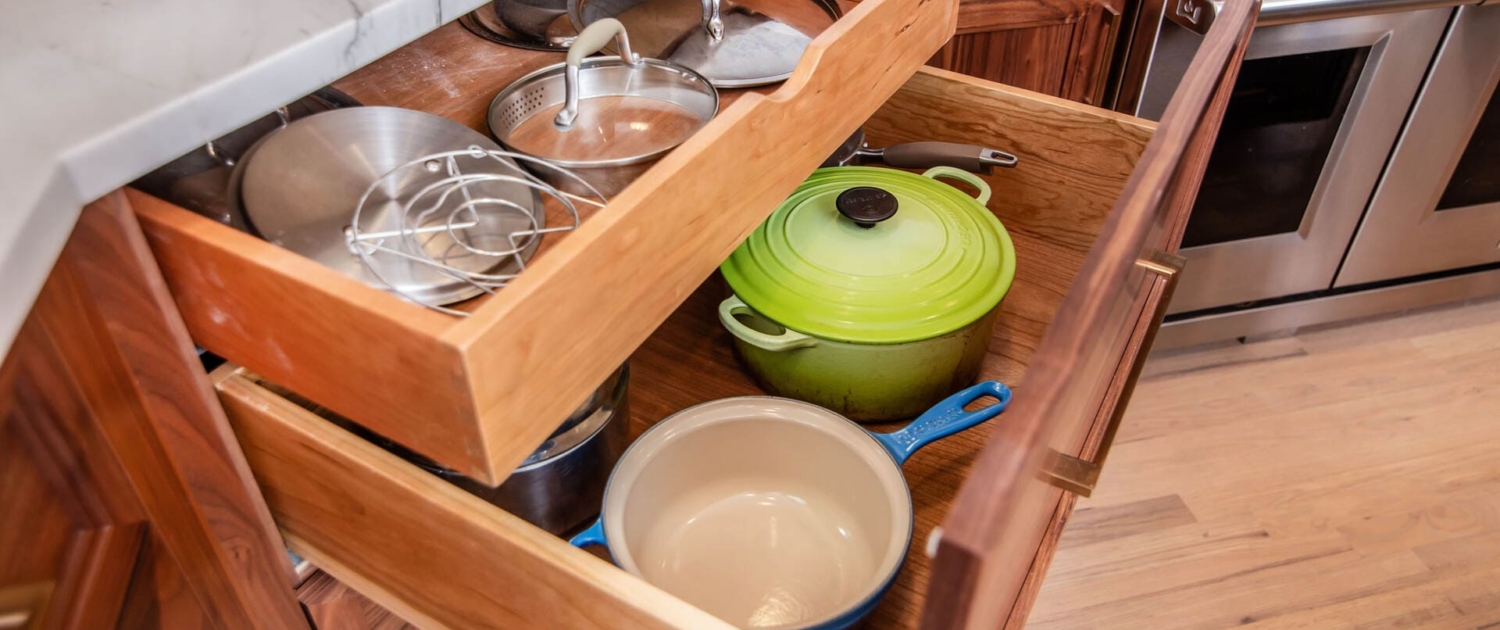 Walnut cabinet drawers with white countertops