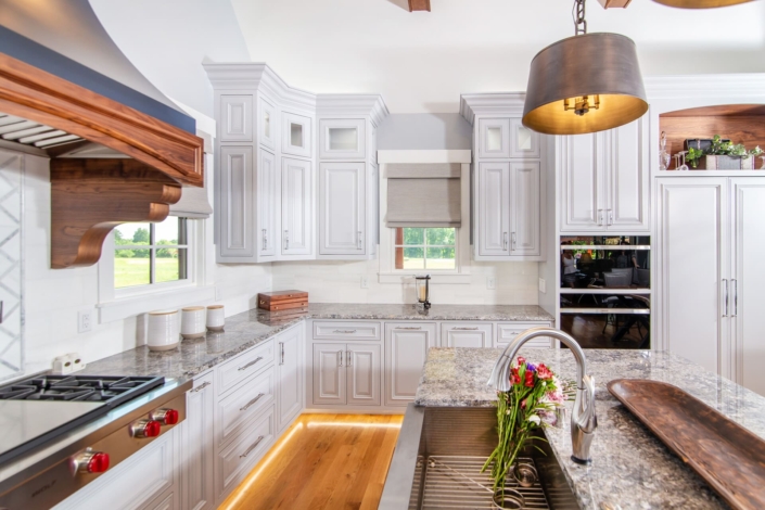 white cabinet with foot lighting