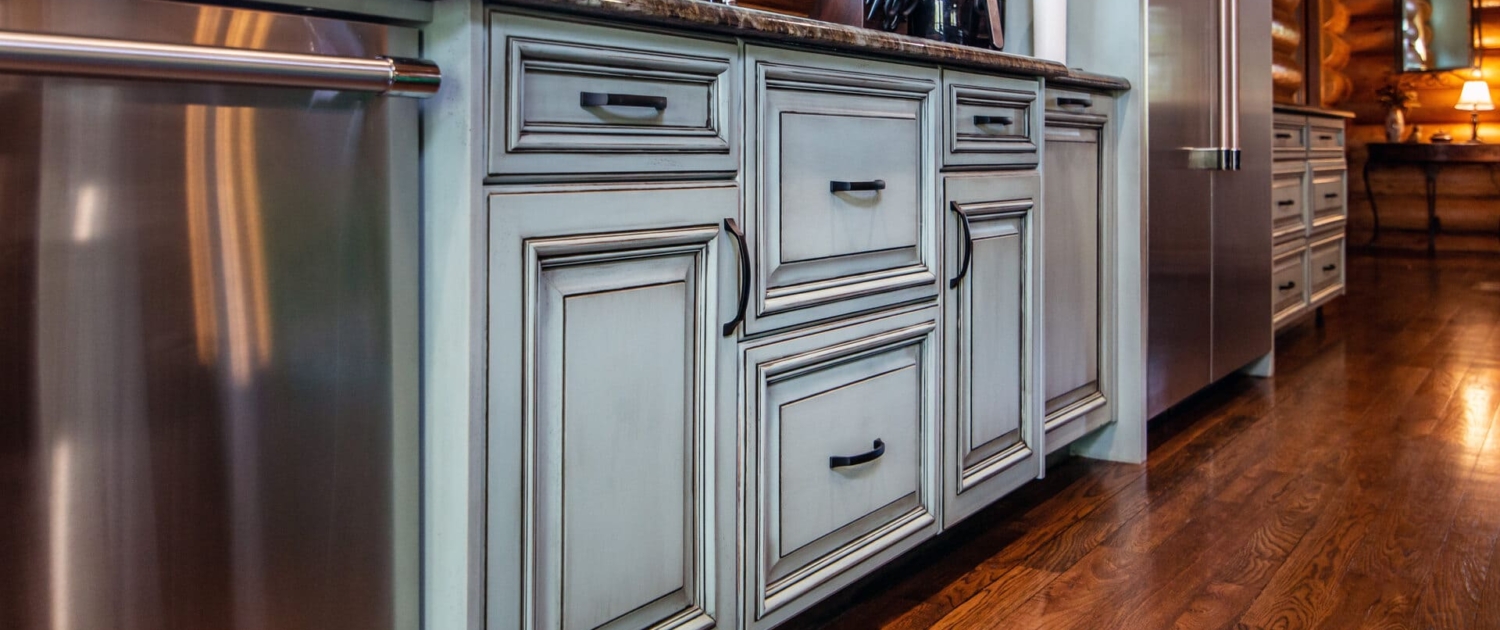 green kitchen with hardwood floors