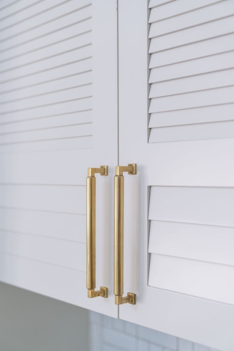 gold hardware on white cabinets