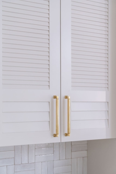 tile backsplash and gold hardware