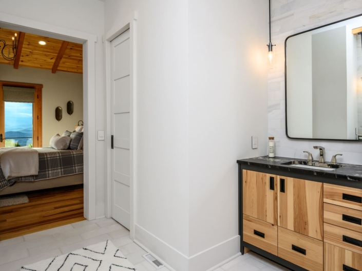 bathroom with a vanity and a bedroom