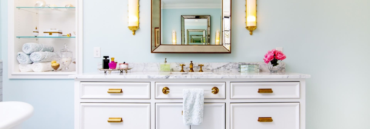 white vanity and a large tub