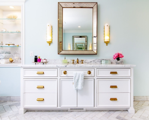 white vanity and a large tub