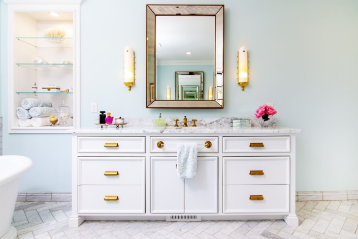 white vanity and a large tub