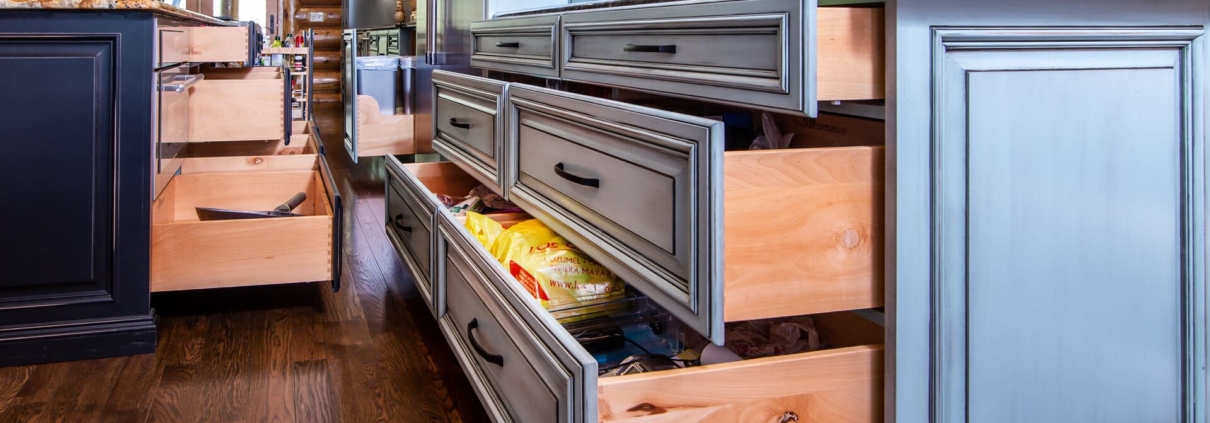 green kitchen and black island