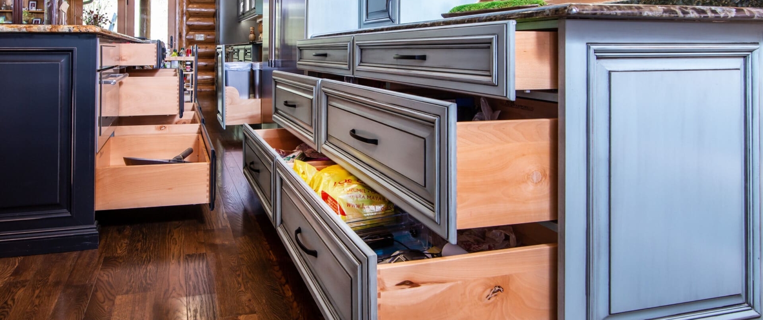 green kitchen and black island