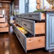 green kitchen and black island