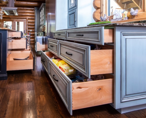 green kitchen and black island