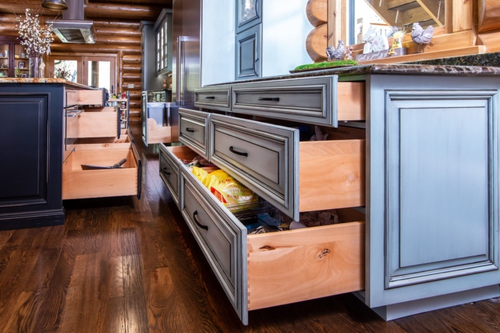 green kitchen and black island