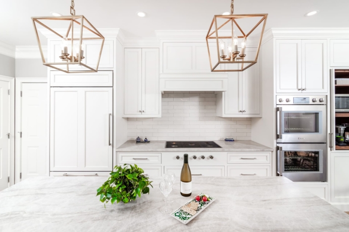 gold lights over plants on a counter