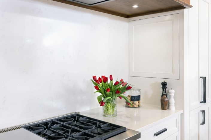 white kitchen with flowers and cookies
