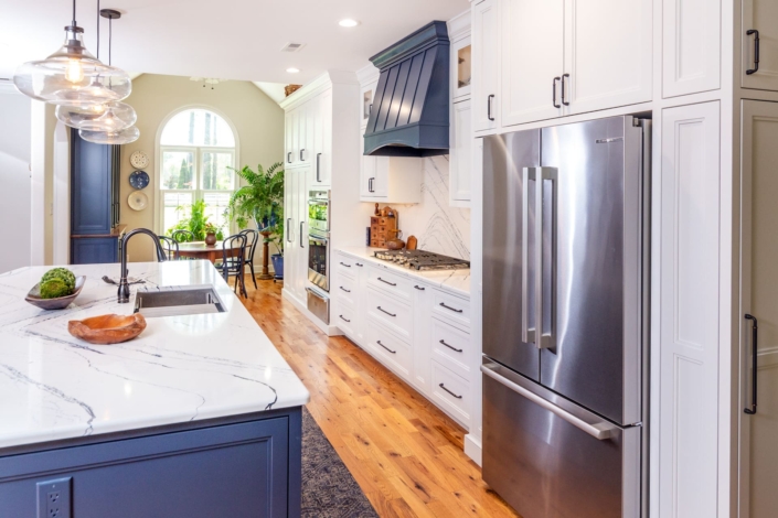 white kitchen with blue hood