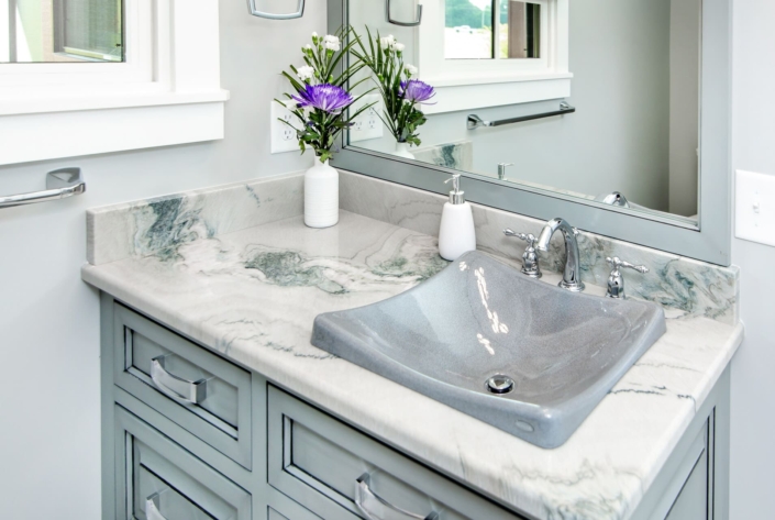 blue bathroom vanity with flowers