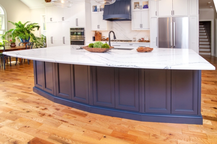 blue kitchen island with marble countertops