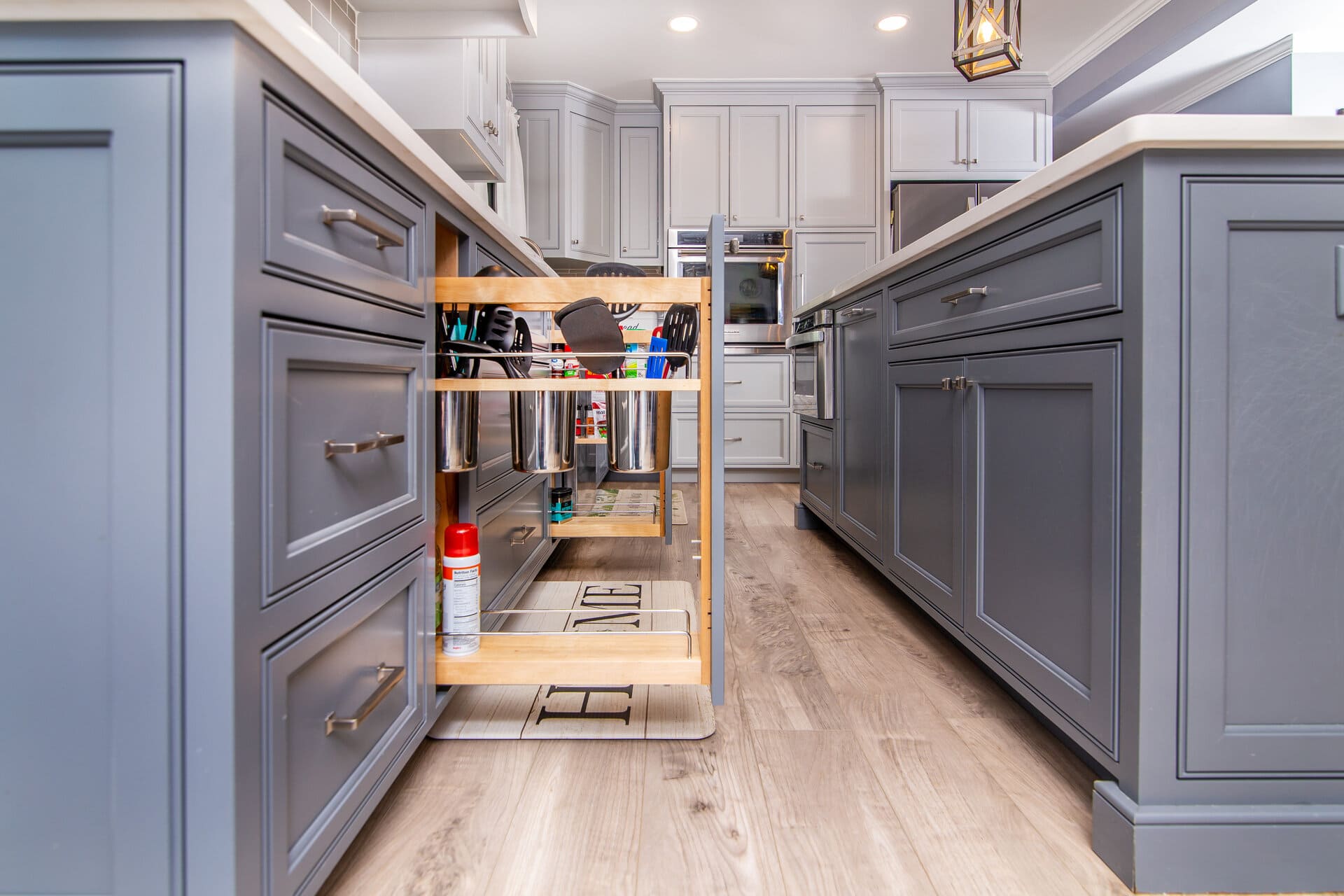 blue kitchen with a utensil pullout