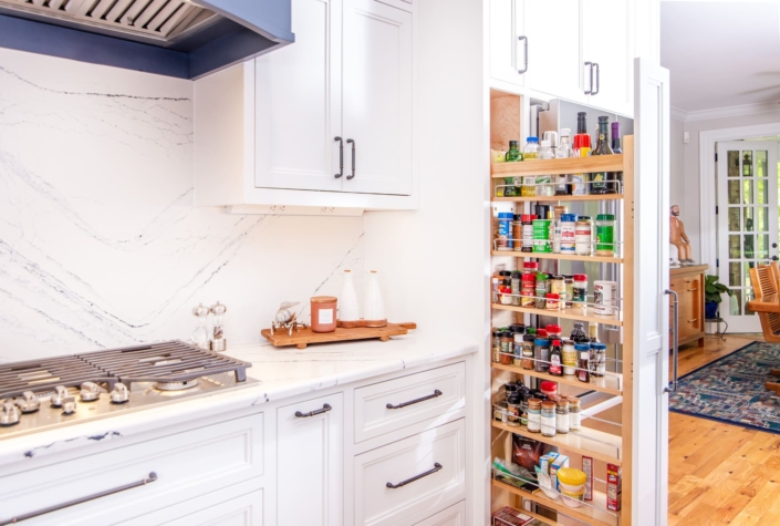 white kitchen with marble backsplash