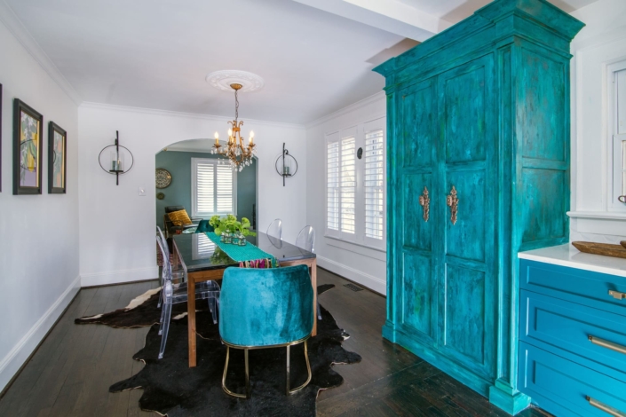 dining room with a teal hutch