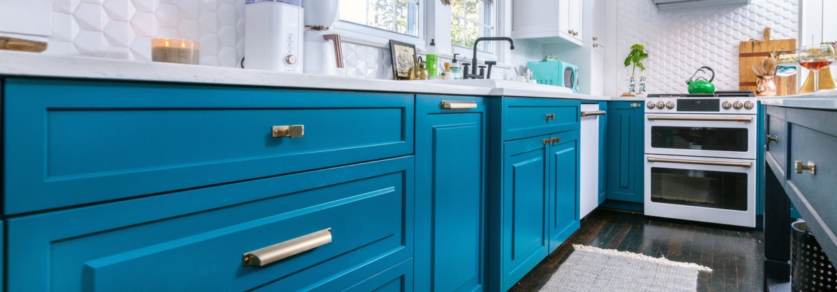 teal kitchen with hardwood floors