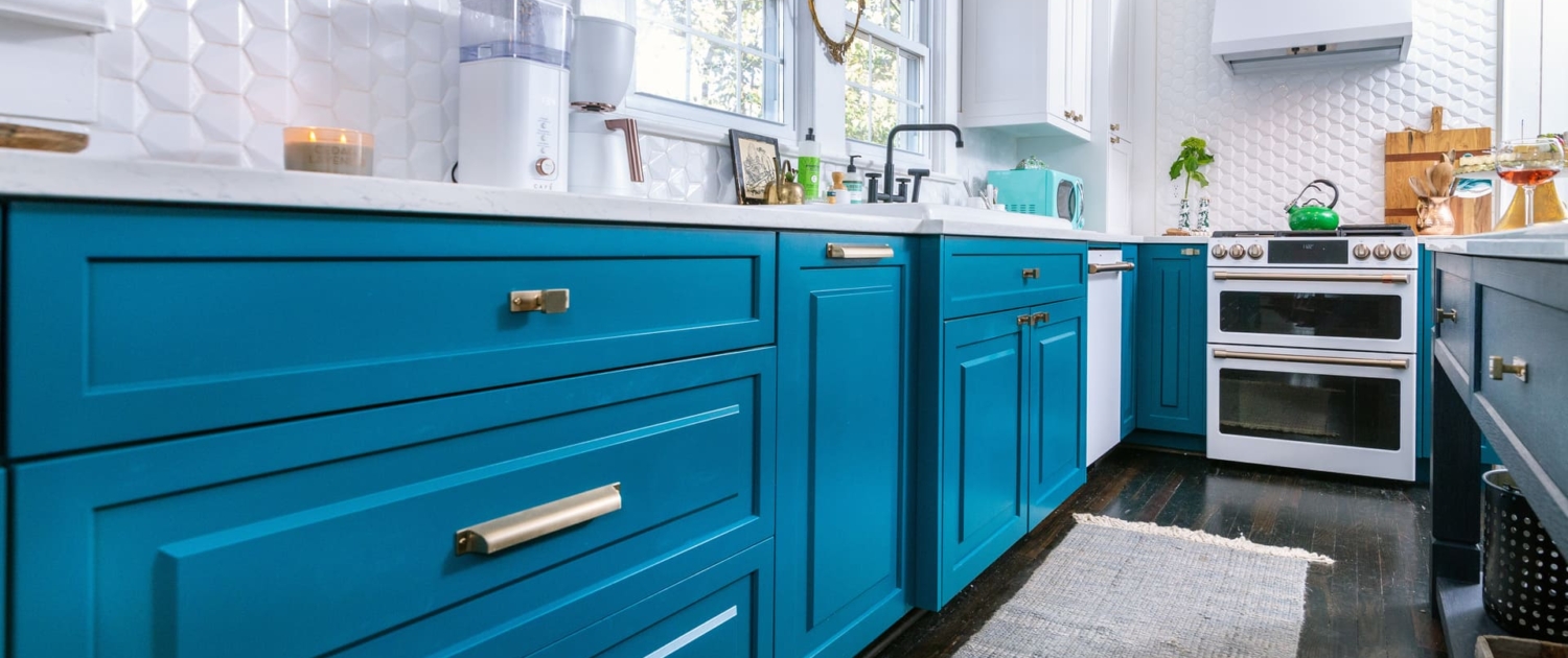 teal kitchen with hardwood floors