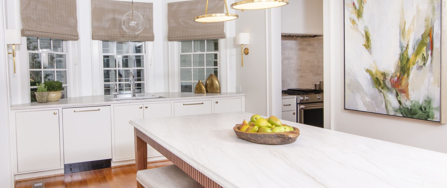 kitchen with a walnut island and a large painting