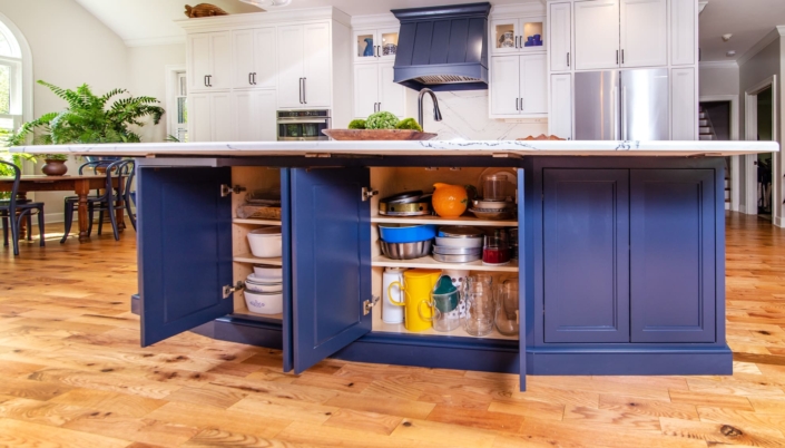 blue kitchen island with storage cabinets