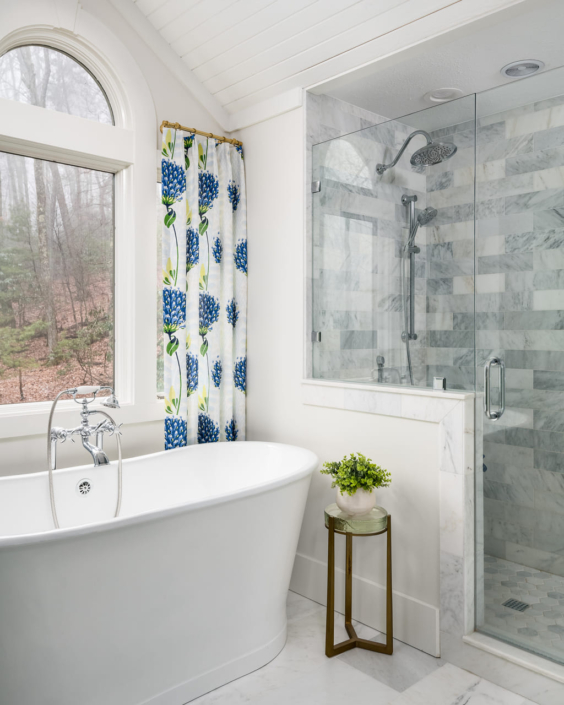 bathroom with a soaker tub and glass walk in shower