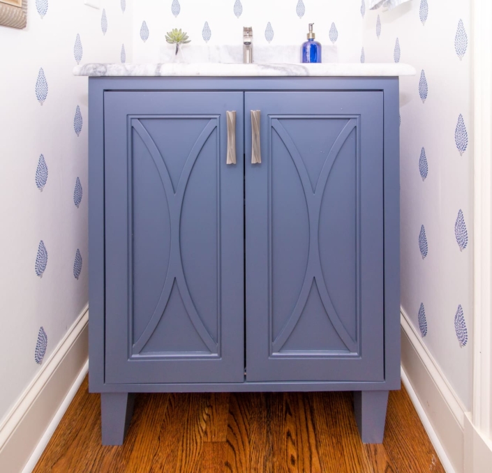bathroom vanity with wallpaper