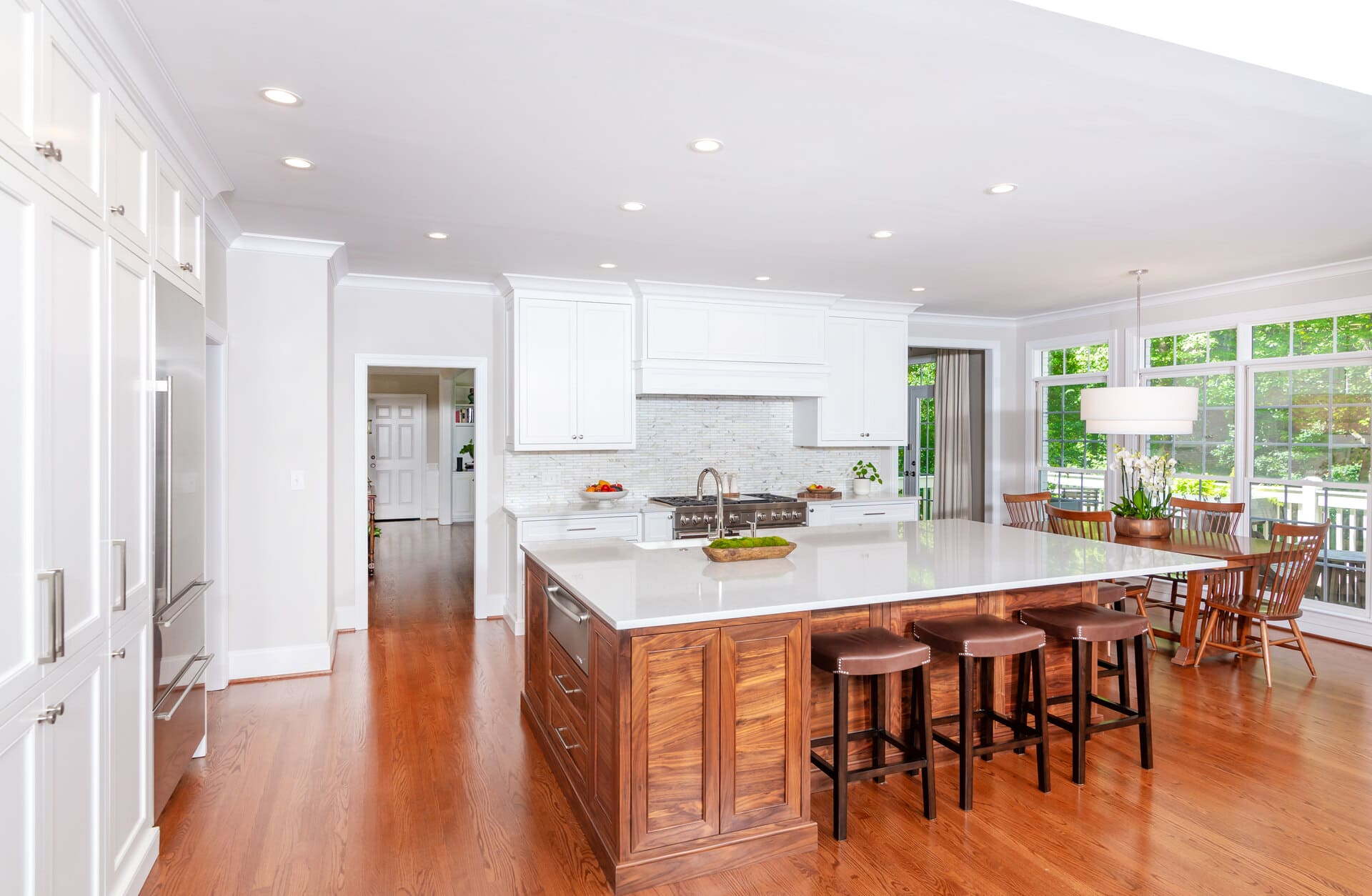 white kitchen and walnut island