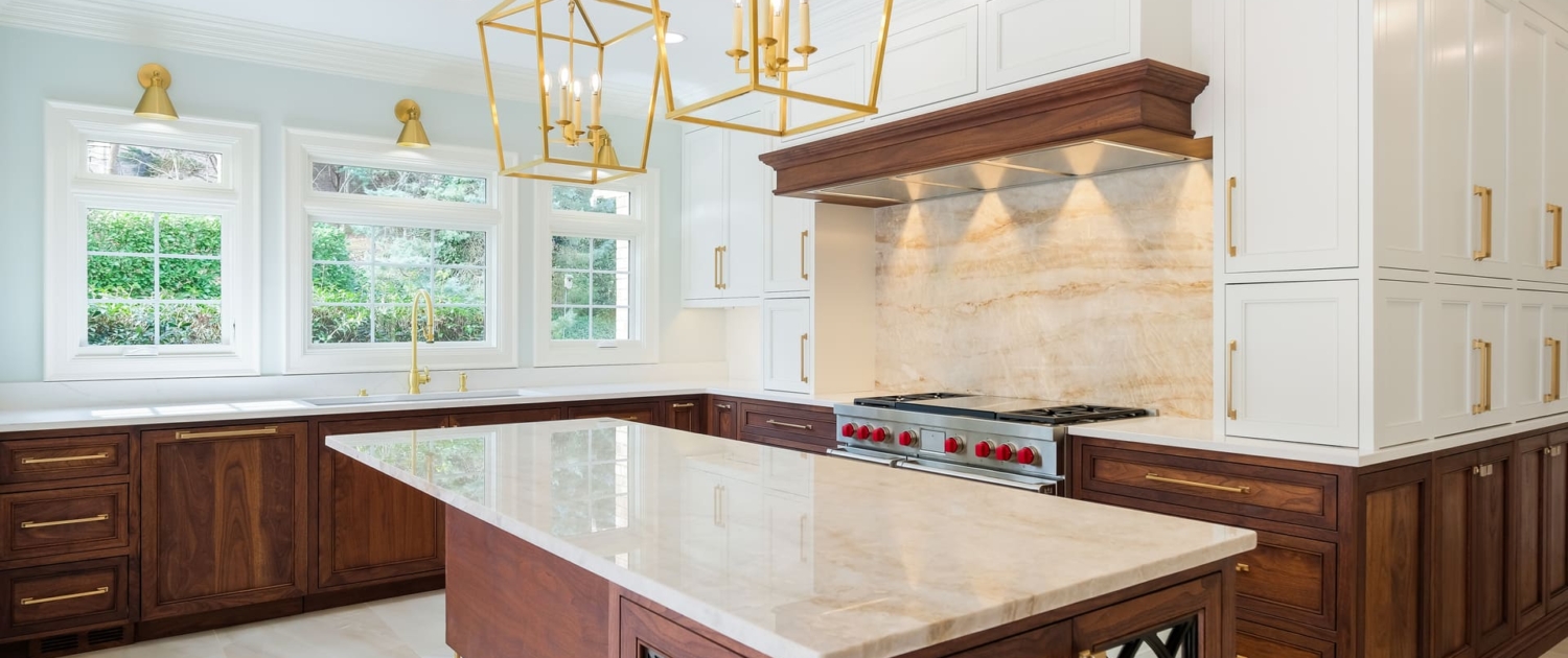 white and brown kitchen with gold lights