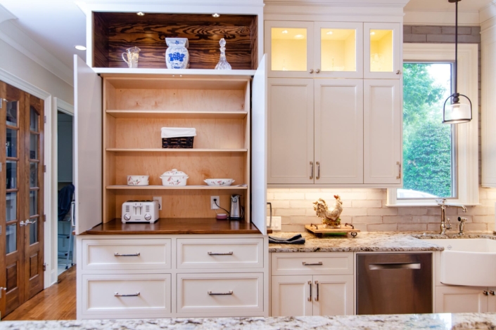white kitchen with appliance storage