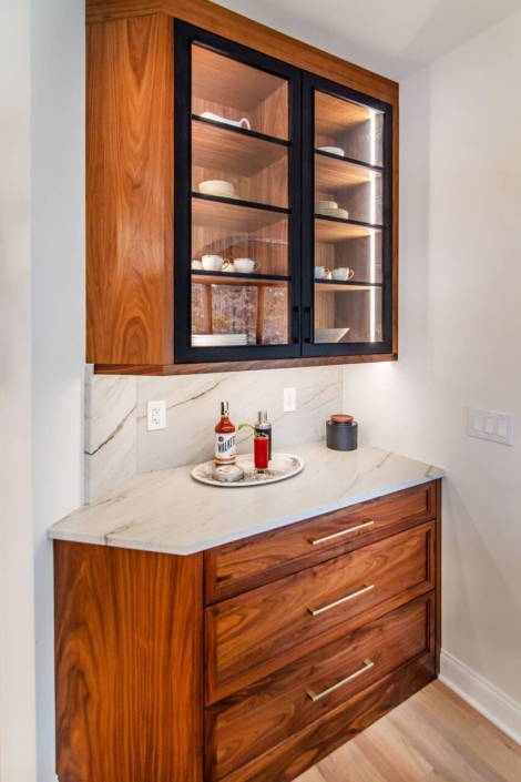 Custom walnut cabinets with white countertops