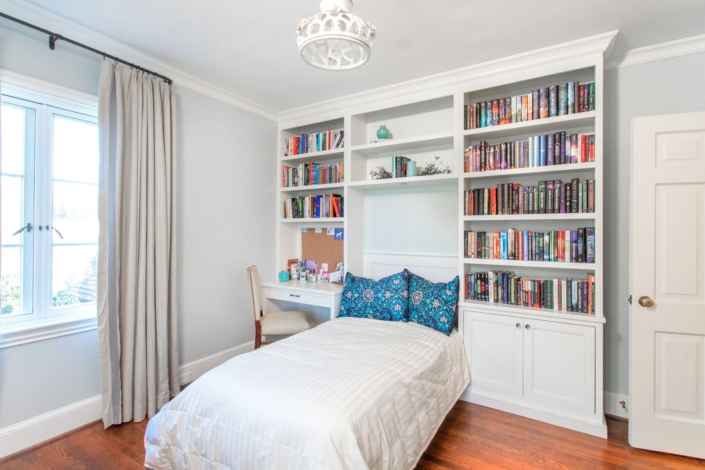 bookshelves built-in over bed